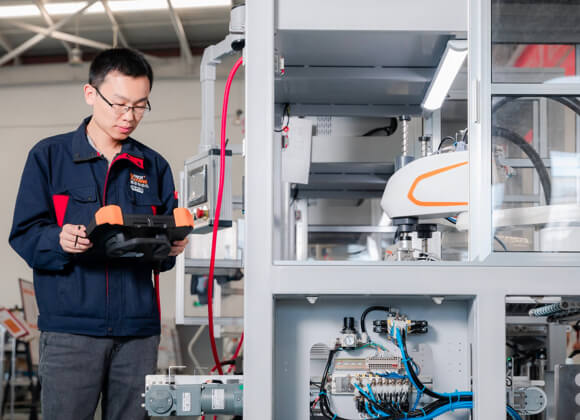 Worker is debugging the machine