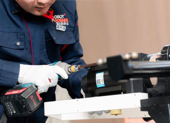 Worker is installing a robot