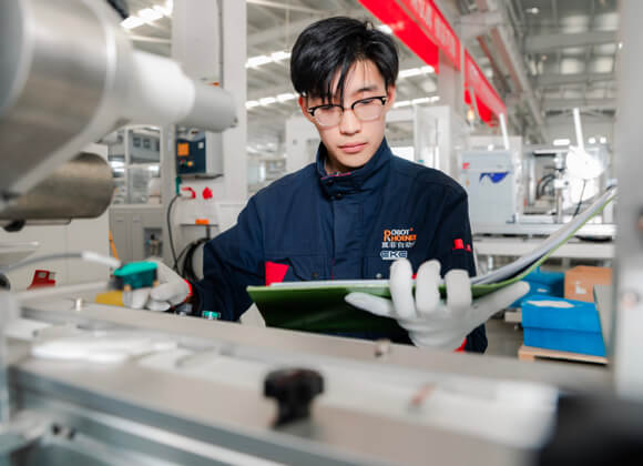 A worker is having a performance test on the machine