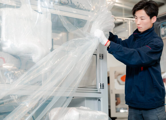 A worker is packing the equippment